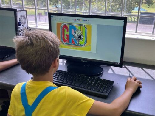 Matthew Hartley uses paint to colour in a computer lesson during Read-A-Thon Week.