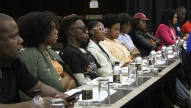 Attendees listen to the speakers.