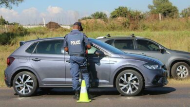 An officer checks the registration of the motorist and the vehicle.