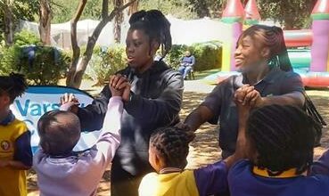 The IIE’s Varsity College Waterfall students Simphiwe Ndumiso Nkosi, and Motsokwane Thatelo play some games with children from the New Jerusalem Children’s Home.