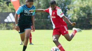Total Football Excellnce player (blue kit) presses the opponents before he could take a shot.