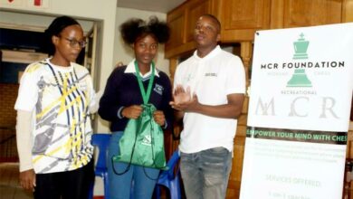 City of Jozi Clothing representative Sarah Mogale, Philasande Biyela, and Midrand Chess Foundation coach Kgosimang Molefe.