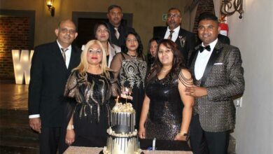 The Well Church members, leaders and pastors with the cake to celebrate the churchs first anniversary. Photo: Sphiwe Masilela
