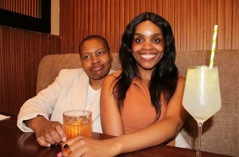 Xihla Khosa and Busi Ndlovu enjoy drinks with big smiles. Photo: Sphiwe Masilela