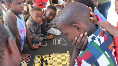 Children are fully focused during a chess match.