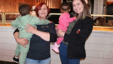 arthKids principal Yvette Page and Doppio Zero owner Carla Swanepoel carrying young learners. Photo: Sphiwe Masilela