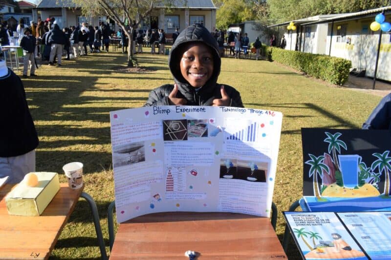 Visitors, including parents, teachers, and learners, eagerly engaged with the displays, asking questions and offering applause and encouragement.