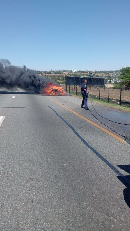 The car is believed to have caught fire, resulting in the closure of some lanes to allow firefighters to extinguish the flames.