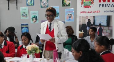 Midland International School Grade 12 learner Malima Kamva reads the pledge on October 17. Photo: Supplied