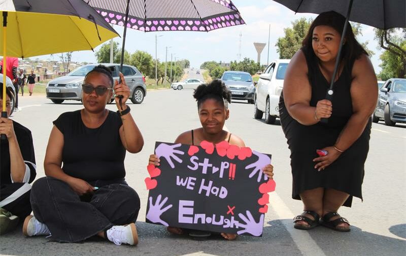 Geraldine, Jada Longmans, and Cherissa Jones block Modderfontein and Dane roads on November 21, 2025. Photo: Sphiwe Masilela