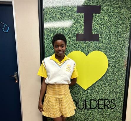 Tiyiselani Prudence Zwane, a JB Matabane Secondary School matriculant, receives R10 000 from Boulders Shopping Centre for outstanding academic achievement.
