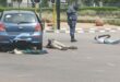 Police watch over the two arrested suspects after a shootout on Allandale Road, Midrand. Photo: Supplied