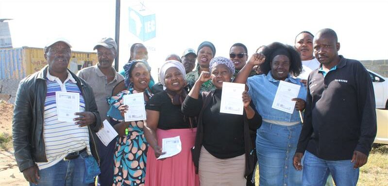 Residents of the Allandale Farm Ext 1 informal settlements at the sports ground after registering to vote. Photo: Zanele Mfaba