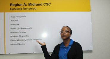 Councillor Lerato Mphefo shows residents of Midrand the services they can access now that the centre is opened. Photo: Zanele Mfaba