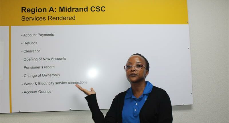 Councillor Lerato Mphefo shows residents of Midrand the services they can access now that the centre is opened. Photo: Zanele Mfaba