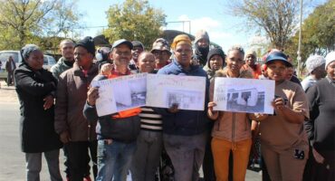 Protesters stand firm during shutdown, demanding mobile classrooms and better facilities on May 6, 2026. Photo: Comfort Makhanya