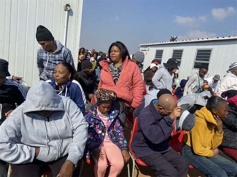 Parents attend an urgent meeting at Dulcie September Primary School on May 30, 2026, to discuss learners' return to class following months of disruption. Photo: Comfort Makhanya