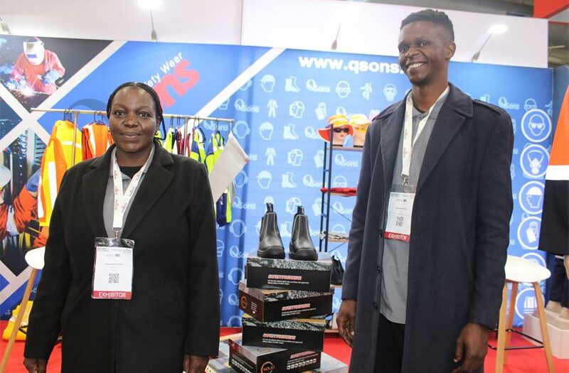 Qsons employees Pfumelani Kukwani and Skhumbuzo Mnisi stand in front of their stall. Photo: Zanele Mfaba