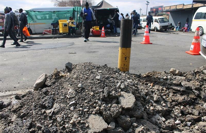 The rubble was removed from potholes as part of the ongoing repairs around Boulders taxi rank. Photo: Zanele Mfaba