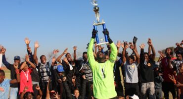 Hawks FC players celebrate with the Midrand Promotional League trophy after securing the league title and promotion to the Regional League at Rabie Ridge Stadium on June 7, 2026. Photo: Comfort Makhanya