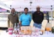 Members of the Agricultural Research Council, Kevin Kutumela, Rhandzu Mahumane and Kingsly Shikwambana showcasing vegetables, vegetable juice and vegetable gummies that they produce on June 10. Photo: Zanele Mfaba