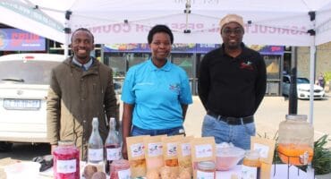 Members of the Agricultural Research Council, Kevin Kutumela, Rhandzu Mahumane and Kingsly Shikwambana showcasing vegetables, vegetable juice and vegetable gummies that they produce on June 10. Photo: Zanele Mfaba