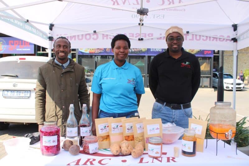Members of the Agricultural Research Council, Kevin Kutumela, Rhandzu Mahumane and Kingsly Shikwambana showcasing vegetables, vegetable juice and vegetable gummies that they produce on June 10. Photo: Zanele Mfaba