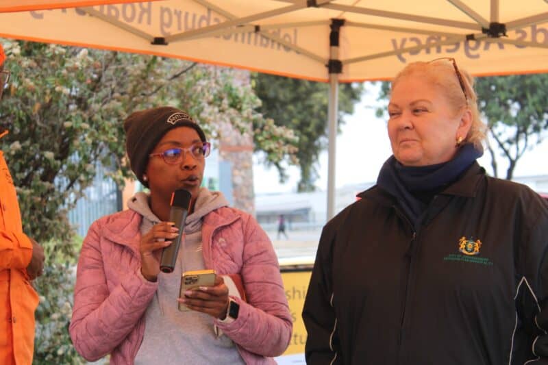 Ward 112 councillor Lerato Mphefo and Ward 132 councillor Annette Deppe address residents and city officials during the launch of Operation Restore in Midrand on June 18. Photo: Comfort Makhanya