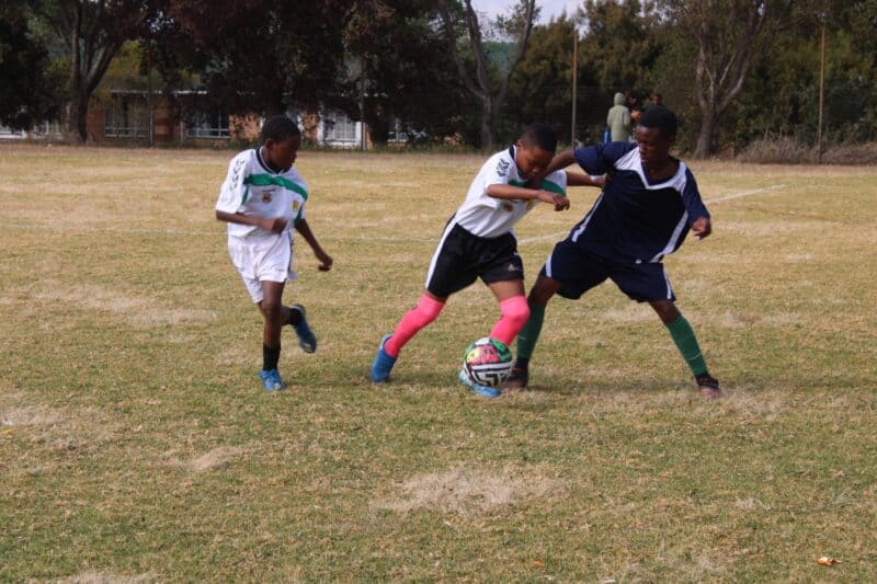 Johannesburg West and Johannesburg South played an intense U15 match at Midrand High School, with both teams displaying resilience and skill in a thrilling 2-2 draw during district soccer trials.