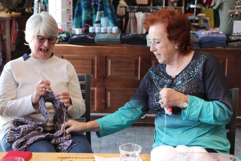 Tracy Beyleveld and Linda Joseph share a laughter while knitting at their sessions for this month on June 24, 2026. Photo: Zanele Mfaba