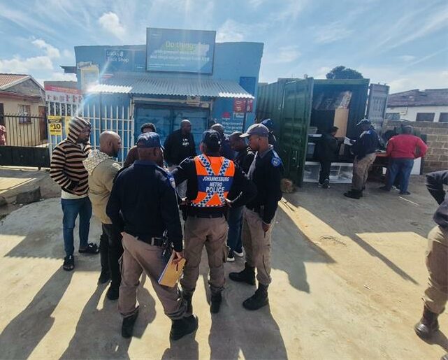 JMPD officers close down non-compliant shops in Mayibuye. Photo: Zanele Mfaba