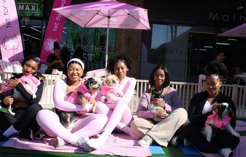 Angela Slique, Aobakwe Seepolle, Innocentia Masombuka, Naomi Kekana, and Teelo Mathabe hold some of the Woodrock puppies after their yoga session. Photo: Zanele Mfaba