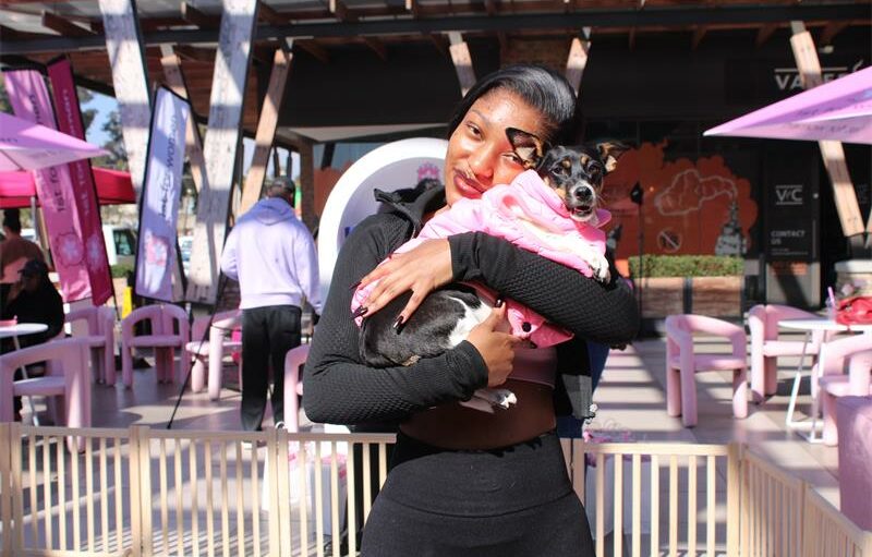 Angela Slique shares some puppy love with one of the puppies after their yoga session. Photo: Zanele Mfaba