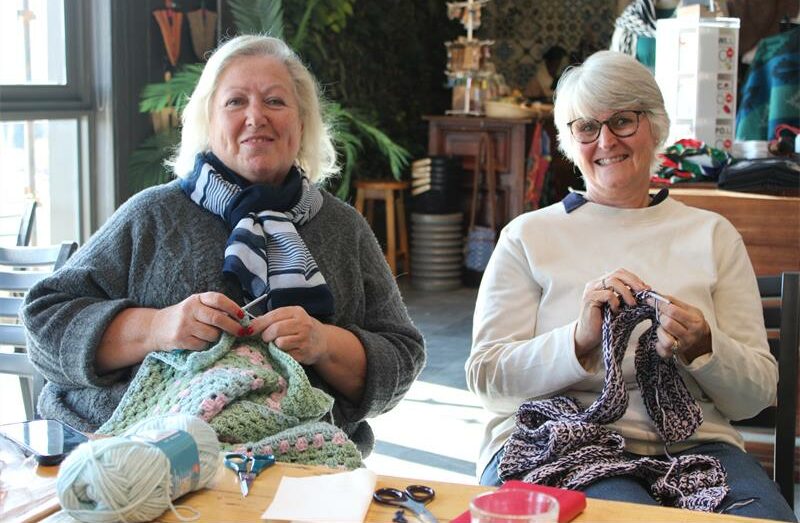Members of Knit and Natter Kyalami Sheila Evers and Tracy Beyleveld knit a warm blanket and scarf. Photo: Zanele Mfaba
