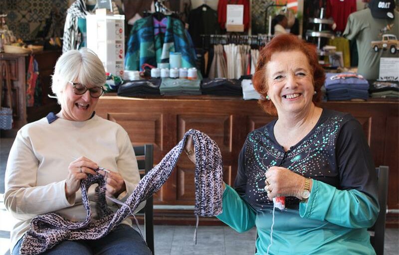 Tracy Beyleveld and Linda Joseph share a laugh while knitting at one of their sessions with the Kyalami group. Photo: Zanele Mfaba
