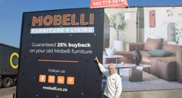 Ward 94 Councillor David Foley shows some of the illegal advertisements at the R55 and M71 intersection. Photo: Zanele Mfaba