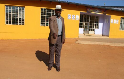 Hopkins Kaira shows the front yard of the administration office that needs paving. Photo: Zanele Mfaba