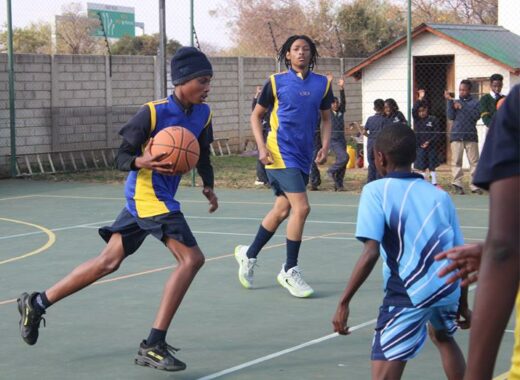 A Nova Pioneer player, Melokuhle Machabe, drives to the basket as defenders close in during the U15 clash against Sandton School Group on June 25. Photo: Comfort Makhanya