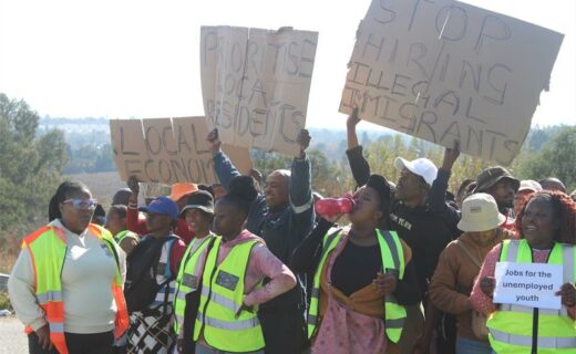 Residents display placards calling for local employment opportunities as they march peacefully to Midrand Industrial Park on June 29, 2026. Photo: Comfort Makhanya