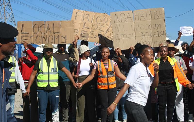 Residents display placards calling for local employment opportunities as they march peacefully to Midrand Industrial Park on June 29, 2026. Photo: Comfort Makhanya