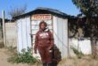 Annikie Mothibi stands next to the zozo structure she alleges was moved from her original stand to another section of the Harry Gwala informal settlement while she was recovering in hospital on July 2, 2026. Photo: Comfort Makhanya