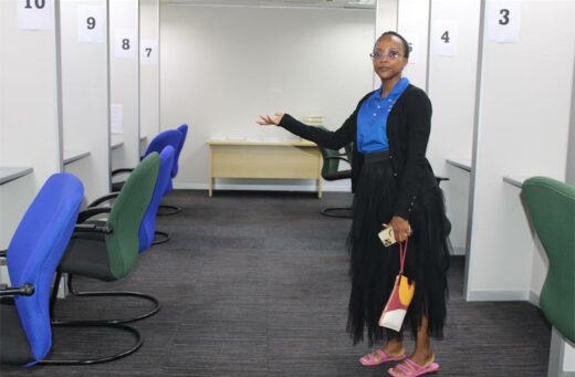 Councillor Lerato Mphefo shows residents of Midrand the services they can access inside the centre with entrance being allowed inside the centre. Photo: Zanele Mfaba