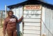 Annikie Mothibi stands next to the zozo structure she alleges was moved from her original stand to another section of the Harry Gwala informal settlement while she was recovering in hospital on July 2. Photo: Comfort Makhanya