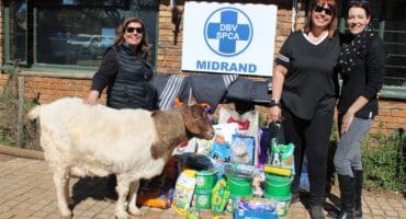 Donors Lynne Maclean, Patricia Nementzik, and Midrand SPCA Volunteer/Chairperson Brenda Lucas after the handover of pet food, blankets, and cleaning supplies to the SPCA on Mandela Day. Photo: Zanele Mfaba