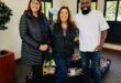 Noordwyk Parkrun members Patricia Nementzik, Lynne Maclean, and Reverend David Kobedi after donating to the Christ Church. Photo: Supplied