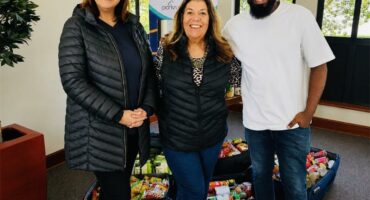 Noordwyk Parkrun members Patricia Nementzik, Lynne Maclean, and Reverend David Kobedi after donating to the Christ Church. Photo: Supplied