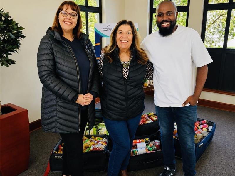 Noordwyk Parkrun members Patricia Nementzik, Lynne Maclean, and Reverend David Kobedi after donating to the Christ Church. Photo: Supplied