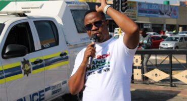 Region A March and March coordinator and convener Thabiso Gerald Mehlape, addresses the protesters and the community members before the march begins to Midrand High. Photo: Zanele Mfaba