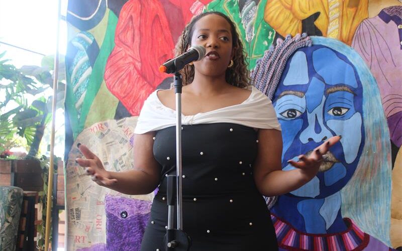 Spoken word artist Nyasha Chivonivoni (Nychii) performs a poem about Heritage to entertain guests at the silent auction. Photo: Zanele Mfaba