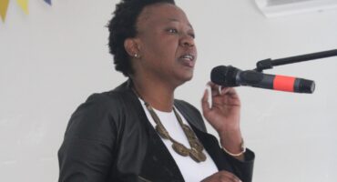 Family representative Fatima Selane pays tribute to Lebo Xolwana and her three children on August 6, 2026. Photo: Comfort Makhanya